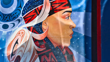 Mural of a woman in indigenous dress in Montreal, Canada.
